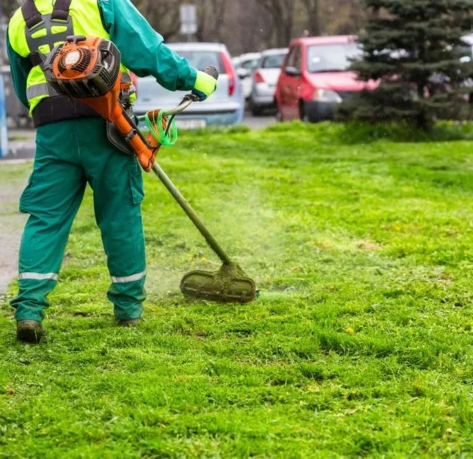 A,Worker,In,High,Visibility,Clothing,Maintains,Public,Spaces,,Expertly