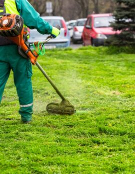 A,Worker,In,High,Visibility,Clothing,Maintains,Public,Spaces,,Expertly