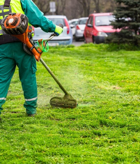 A,Worker,In,High,Visibility,Clothing,Maintains,Public,Spaces,,Expertly