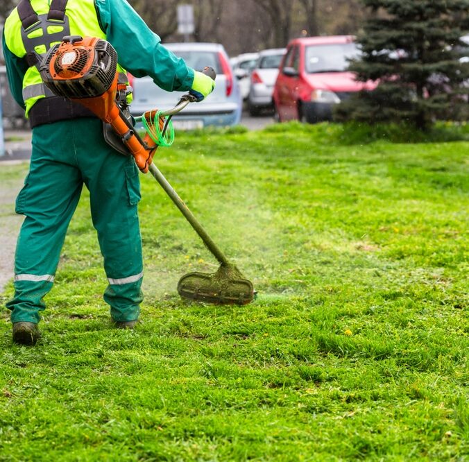 A,Worker,In,High,Visibility,Clothing,Maintains,Public,Spaces,,Expertly