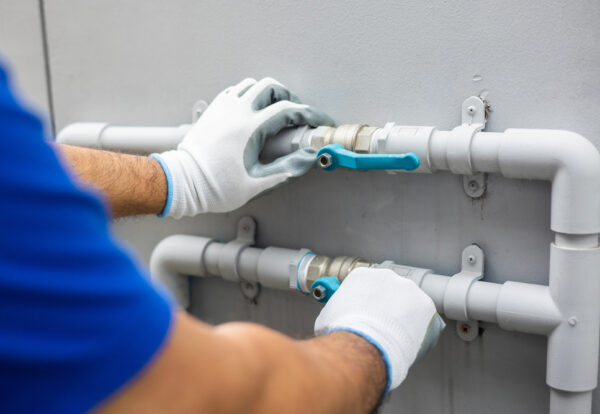 Male,Plumber,Worker,Installation,Pipe,System,Use,Tape,Measure,Level