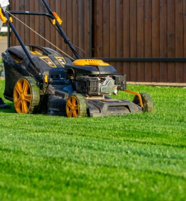 Green,Grass,Cutting,With,Lawn,Mower,In,Home,Garden,.
